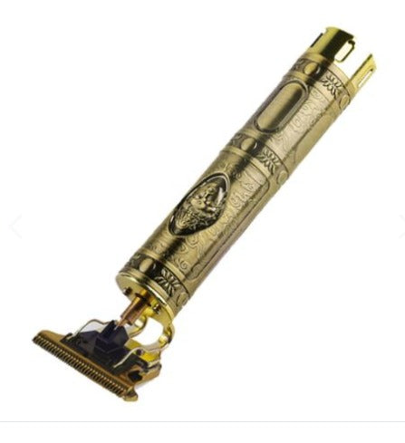 Maquina afeitadora dorada